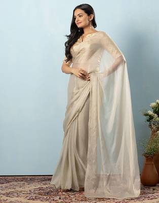 Green plain tissue festive wear saree with blouse piece 1