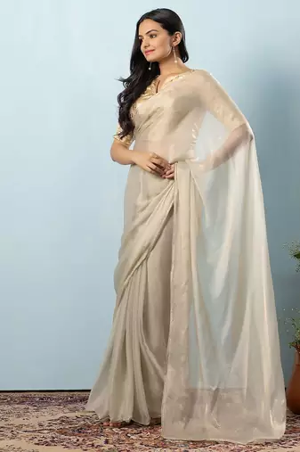 Green plain tissue festive wear saree with blouse piece