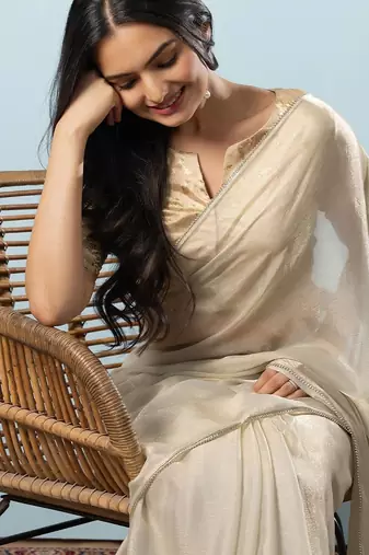 Green plain tissue festive wear saree with blouse piece