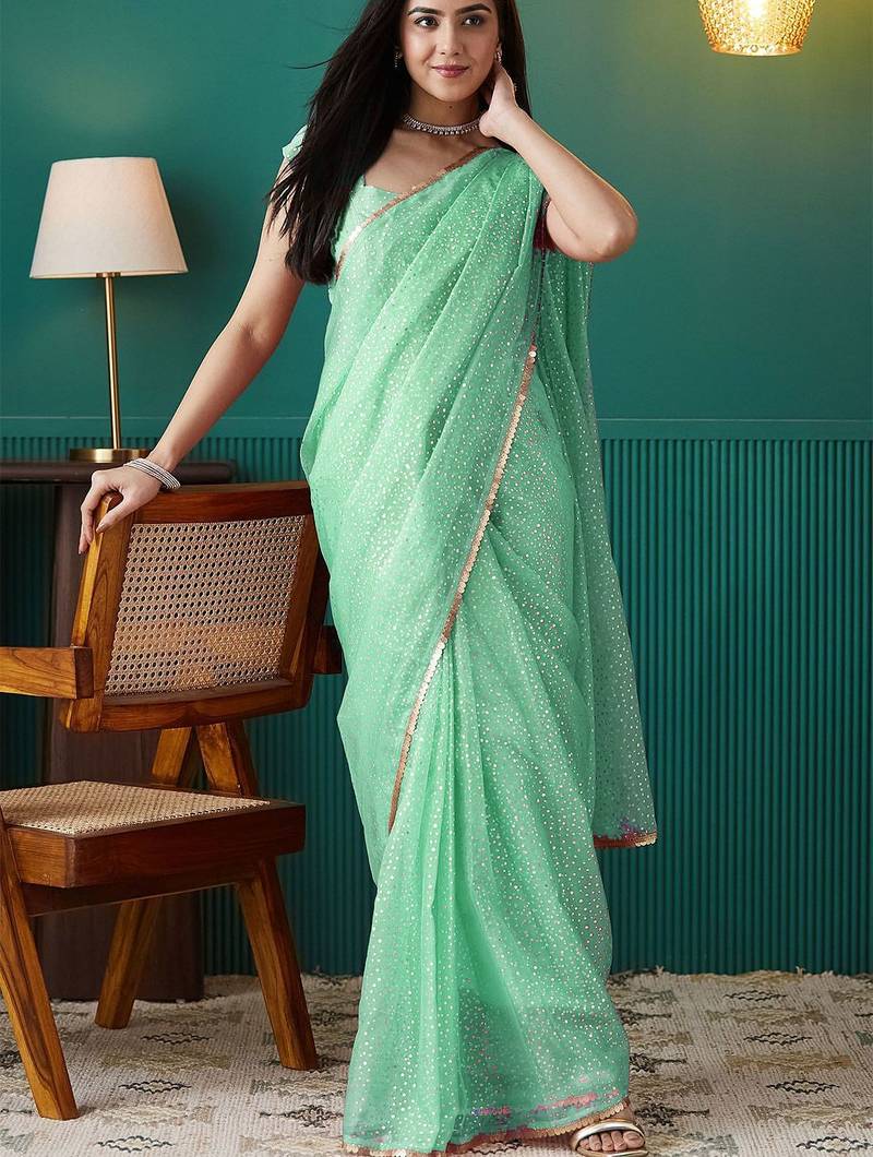 Green elegant printed organza saree with blouse piece