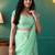 Green elegant printed organza saree with blouse piece