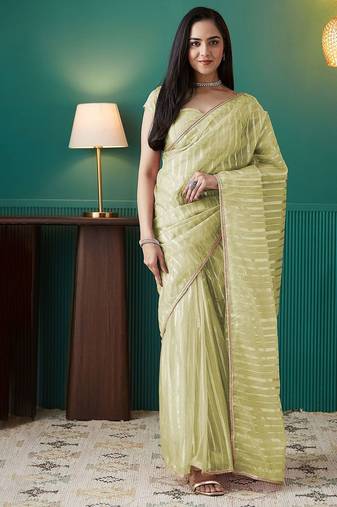Green elegant printed organza saree with blouse piece