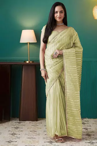 Green elegant printed organza saree with blouse piece