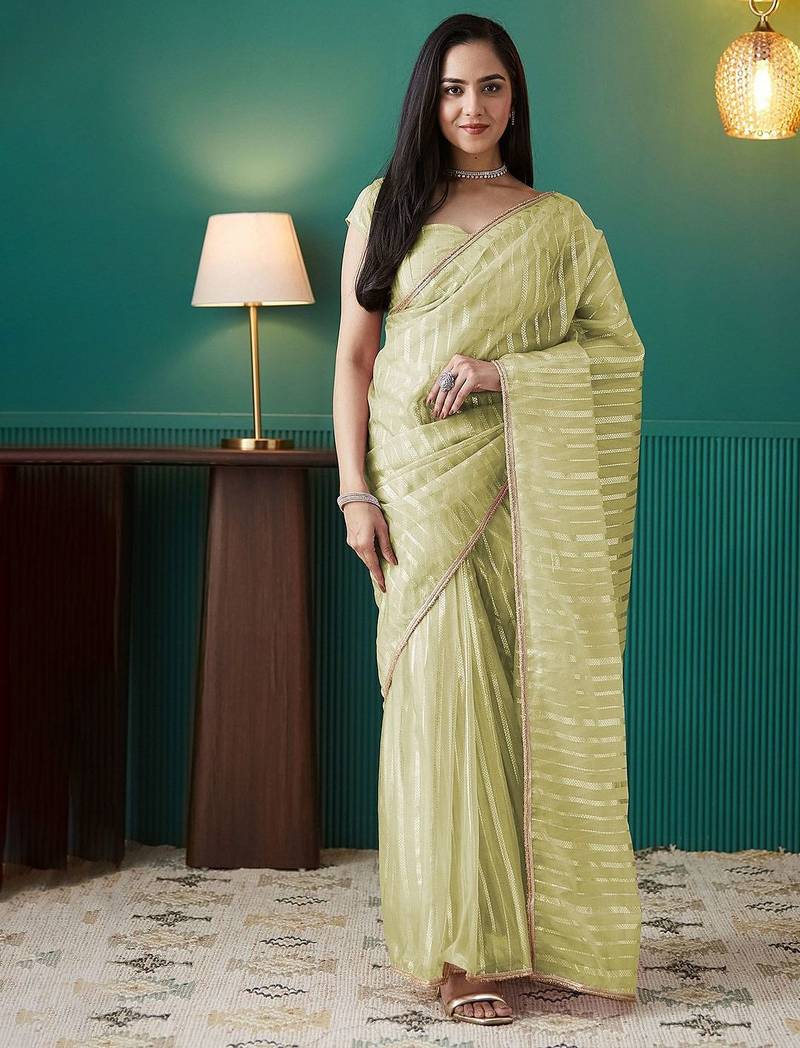 Green elegant printed organza saree with blouse piece