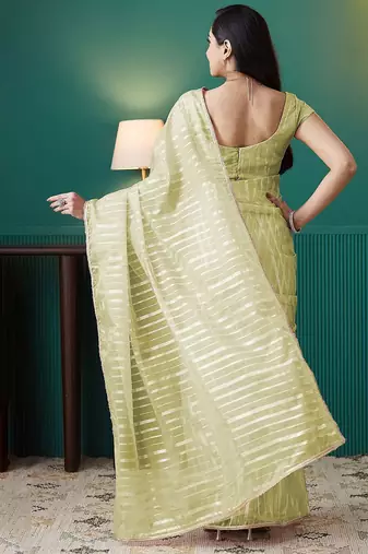 Green elegant printed organza saree with blouse piece