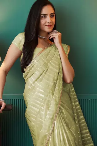 Green elegant printed organza saree with blouse piece