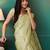 Green elegant printed organza saree with blouse piece