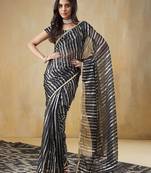 Black elegant printed organza saree with blouse piece