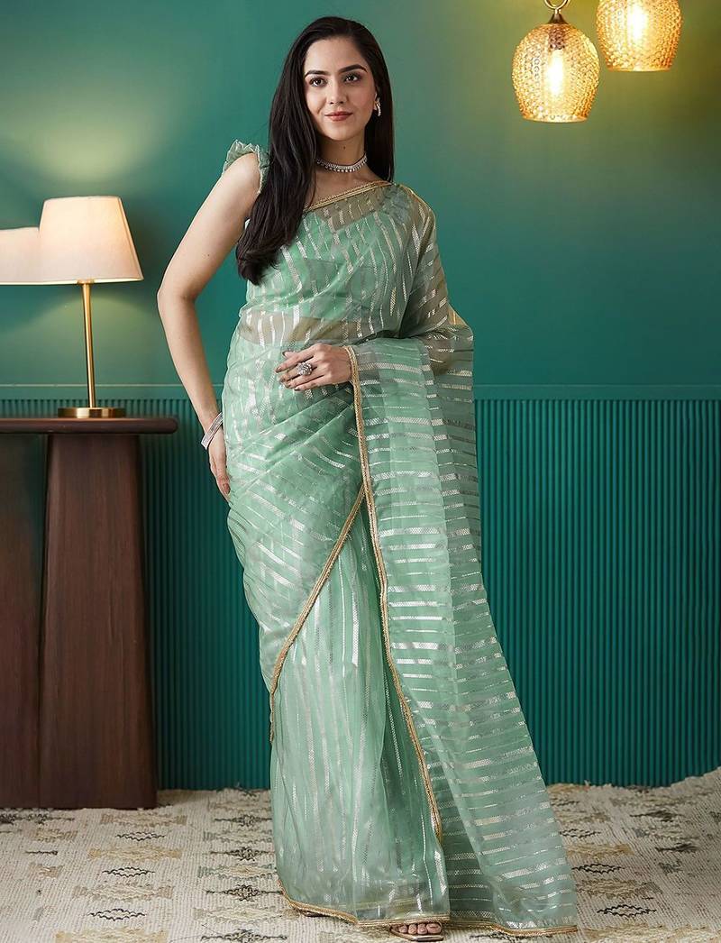 Green elegant printed organza saree with blouse piece
