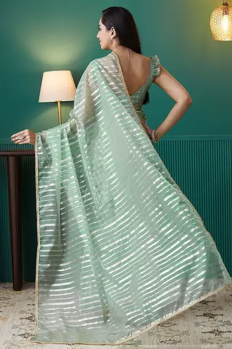 Green elegant printed organza saree with blouse piece