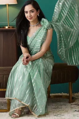Green elegant printed organza saree with blouse piece