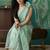 Green elegant printed organza saree with blouse piece