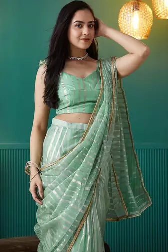 Green elegant printed organza saree with blouse piece
