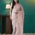 Peach elegant printed organza saree with blouse piece