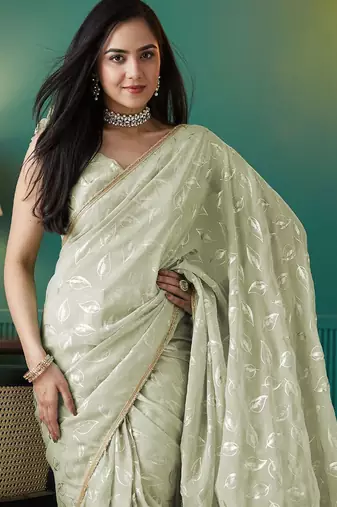 Green elegant printed organza saree with blouse piece