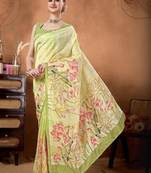 Green elegant printed organza saree with blouse piece