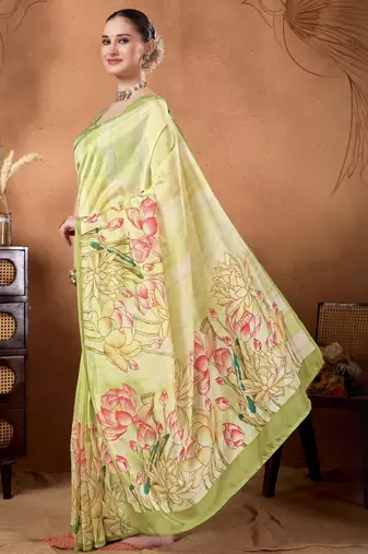 Green elegant printed organza saree with blouse piece