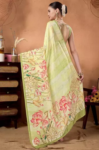 Green elegant printed organza saree with blouse piece