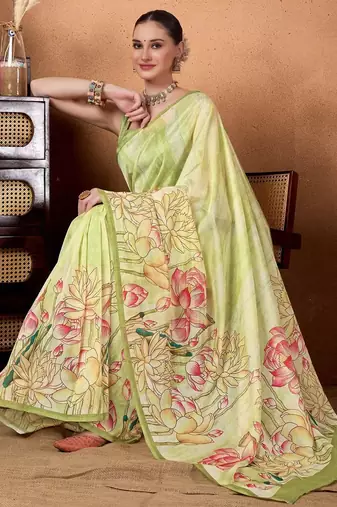 Green elegant printed organza saree with blouse piece
