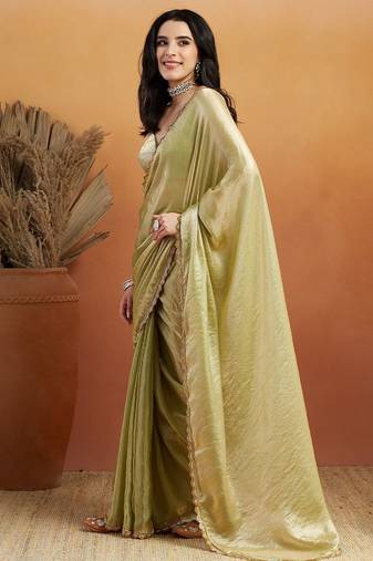 Green plain tissue festive wear saree with blouse piece