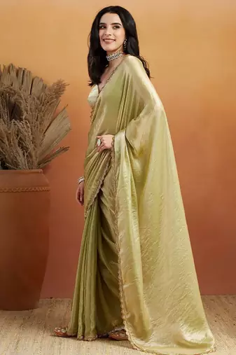 Green plain tissue festive wear saree with blouse piece