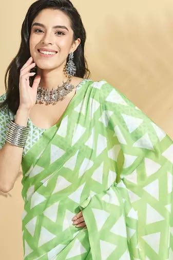 Green printed blended cotton designer saree with blouse piece