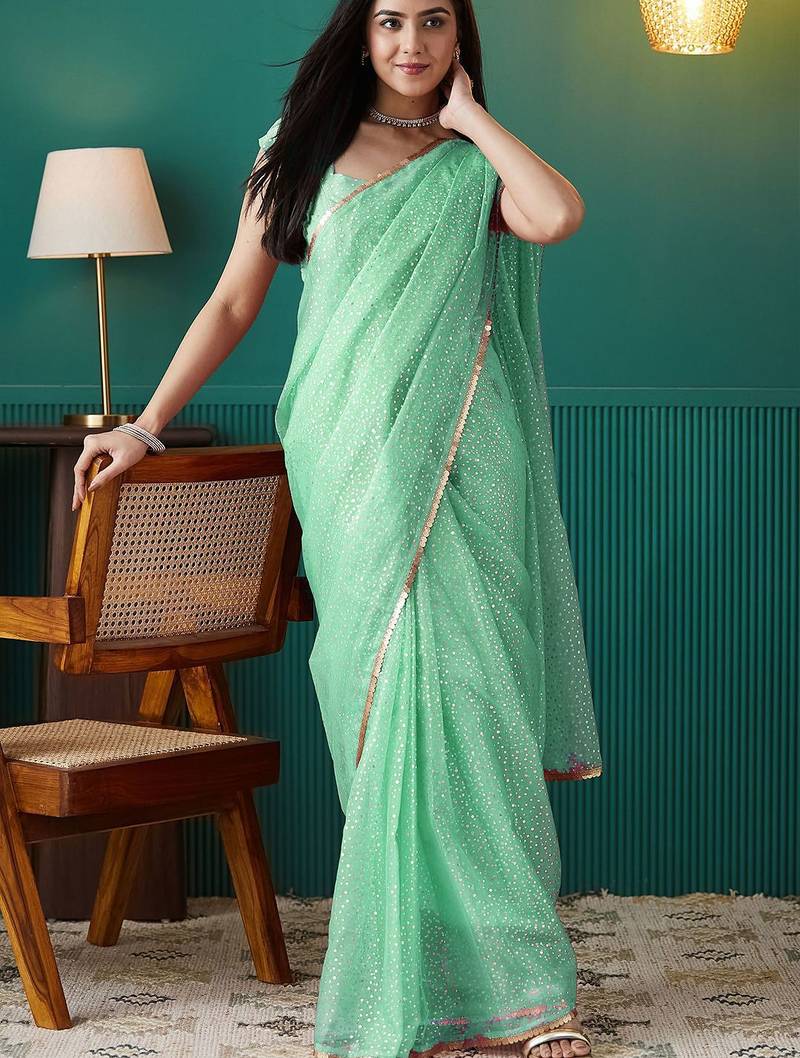 Green elegant printed organza saree with blouse piece