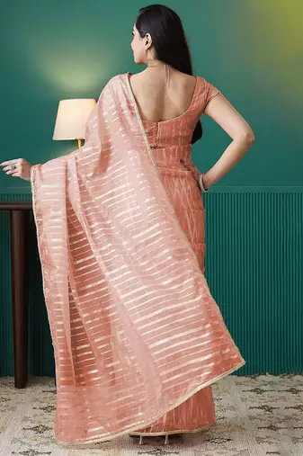 Peach elegant printed organza saree with blouse piece