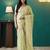 Green elegant printed organza saree with blouse piece
