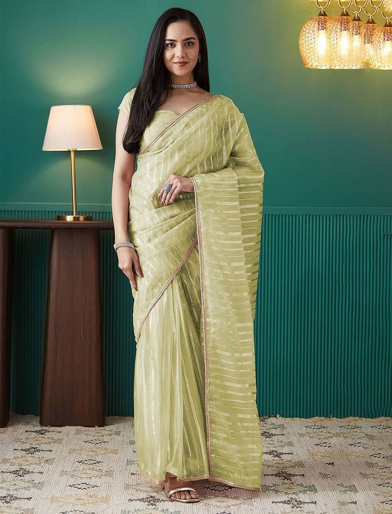 Green elegant printed organza saree with blouse piece