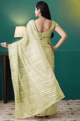 Green elegant printed organza saree with blouse piece