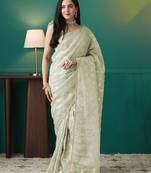Green elegant printed organza saree with blouse piece