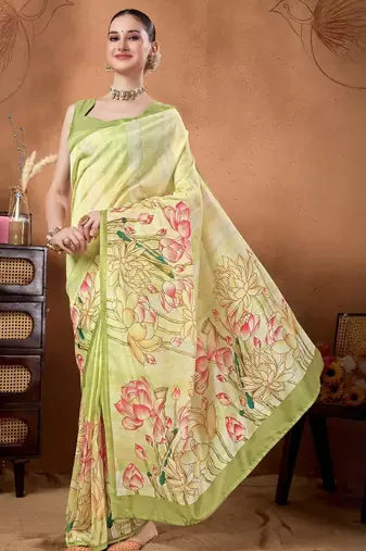 Green elegant printed organza saree with blouse piece