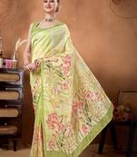 Green elegant printed organza saree with blouse piece
