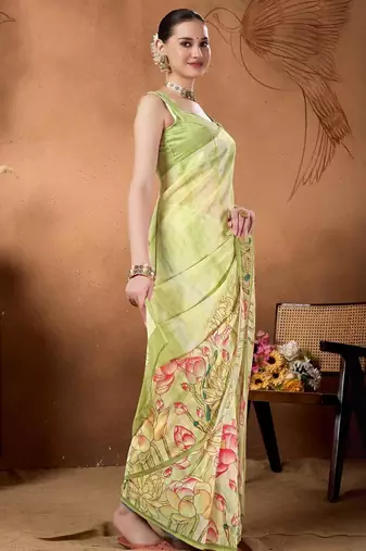 Green elegant printed organza saree with blouse piece