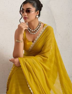 Yellow elegant printed georgette saree with blouse piece 2