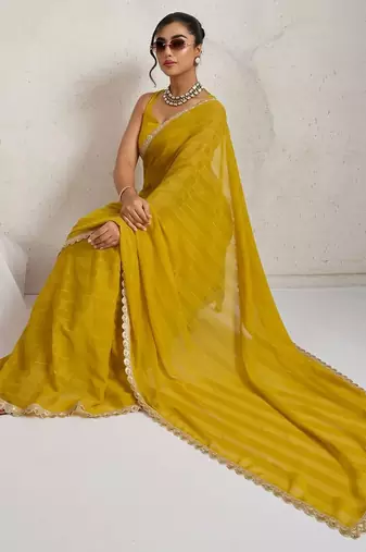 Yellow elegant printed georgette saree with blouse piece