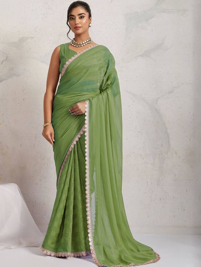 Green printed pure georgette casual saree with blouse piece
