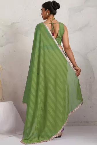 Green printed pure georgette casual saree with blouse piece