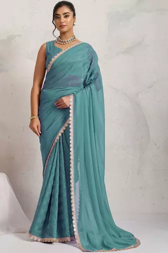 Teal elegant printed georgette saree with blouse piece