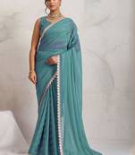 Teal elegant printed georgette saree with blouse piece