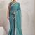 Teal elegant printed georgette saree with blouse piece