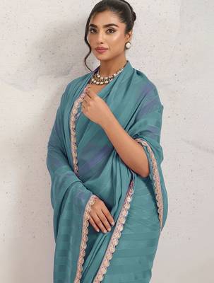 Teal elegant printed georgette saree with blouse piece 2