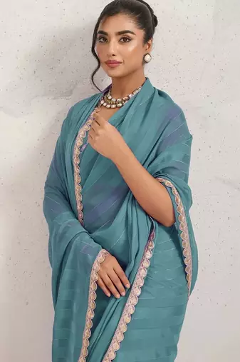 Teal elegant printed georgette saree with blouse piece
