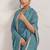 Teal elegant printed georgette saree with blouse piece