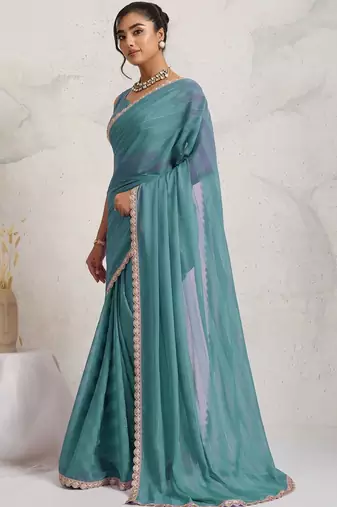 Teal elegant printed georgette saree with blouse piece