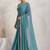 Teal elegant printed georgette saree with blouse piece