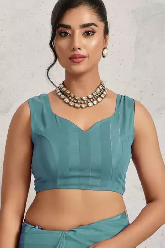 Teal elegant printed georgette saree with blouse piece