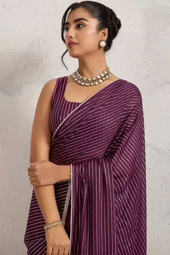 Purple elegant printed georgette saree with blouse piece
