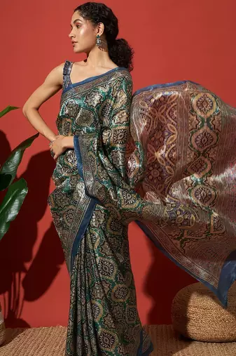 Green printed tissue festive wear saree with blouse piece